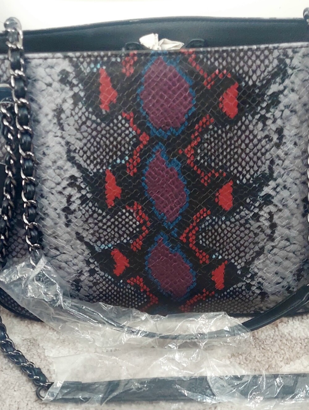 I.NC Women’s Snake-Pattern Crossbody Bag in Black with Red and Purple Accents